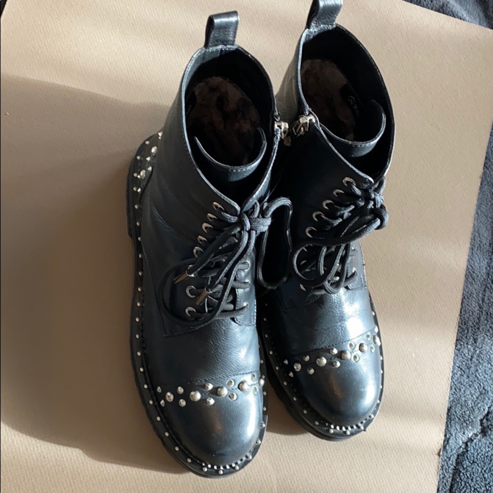 black leather lace up boots with studs.
